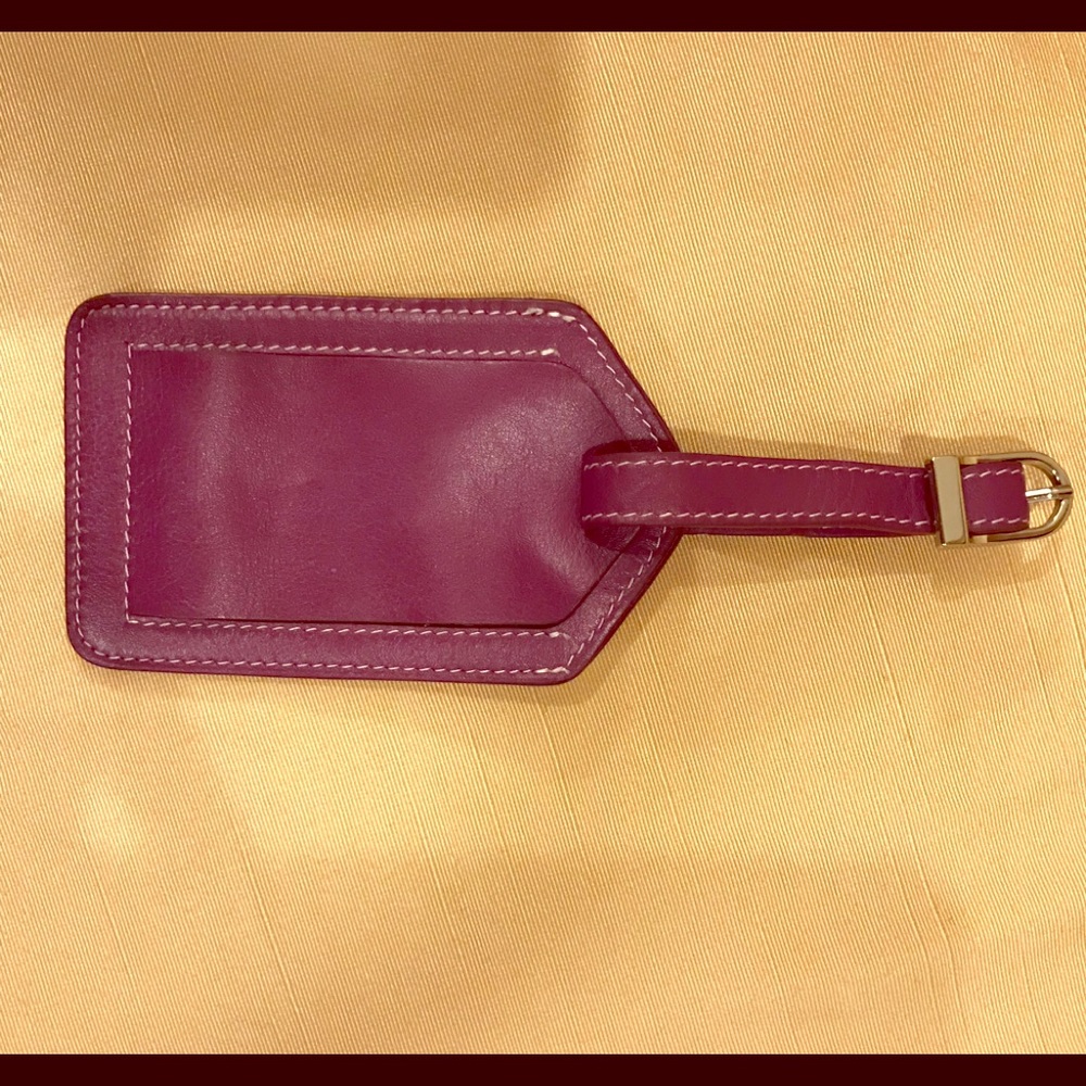 Tusk purple leather luggage tag. NWOT